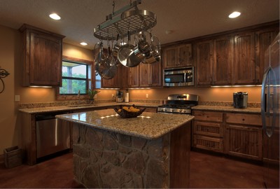 barndominium kitchen with wooden cabinets