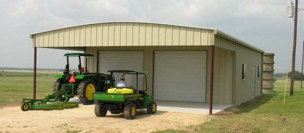 Texas metal building with roof extension and concrete slab.
